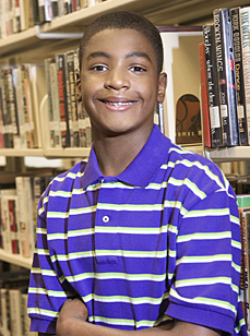 Adolescent male in library